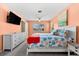 Comfortable main bedroom with TV, dresser, and large window with natural light at 1723 Laramie St, Sarasota, FL 34231