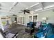 Spacious covered patio with multiple seating areas and backyard views at 1723 Laramie St, Sarasota, FL 34231
