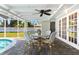 Charming covered patio with an outdoor dining area next to the refreshing pool at 1723 Laramie St, Sarasota, FL 34231