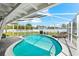 Gorgeous screened-in pool area with lounge chairs and a beautifully landscaped backyard at 1723 Laramie St, Sarasota, FL 34231