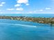 Scenic view of the waterfront and neighborhood with boats sailing on the water on a sunny day at 1723 Laramie St, Sarasota, FL 34231