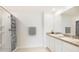 Bathroom featuring dual sinks, granite countertops, and a shower with tub at 17381 Whiskey Creek Trl, Parrish, FL 34219