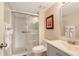 Cozy bathroom with a glass-enclosed shower, a modern vanity, and tasteful wall decor at 2124 N Tamiami Trl # 108, Sarasota, FL 34234