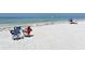 Relaxing beach scene with beach chairs, clear water, and a calming ocean view at 2124 N Tamiami Trl # 108, Sarasota, FL 34234