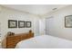 Well-lit bedroom featuring a dresser with decorative items and a spacious closet at 2124 N Tamiami Trl # 108, Sarasota, FL 34234