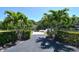 Scenic waterfront property featuring lush palm trees and private dock access for boating at 2124 N Tamiami Trl # 108, Sarasota, FL 34234