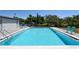 Beautiful community pool with clear blue water and a well-maintained surrounding area at 2124 N Tamiami Trl # 108, Sarasota, FL 34234