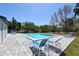 Relaxing pool area features clear water, lounge chairs, and beautifully paved patio area at 2124 N Tamiami Trl # 108, Sarasota, FL 34234