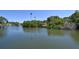 Peaceful waterfront scene with lush green foliage and tranquil water views at 2124 N Tamiami Trl # 108, Sarasota, FL 34234