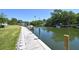 Stunning waterfront view featuring a private dock with boat access and serene water at 2124 N Tamiami Trl # 108, Sarasota, FL 34234