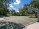 Outdoor basketball court with well-maintained surface, ready for a game at 2475 Wood Oak Dr, Sarasota, FL 34232