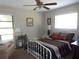 Bedroom with ceiling fan, carpet, and lots of light at 2475 Wood Oak Dr, Sarasota, FL 34232