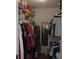Walk-in closet with ample storage space, shelving, and a full-length mirror at 2475 Wood Oak Dr, Sarasota, FL 34232
