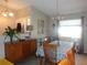 Dining room with decorative light fixture and furnishings at 2475 Wood Oak Dr, Sarasota, FL 34232