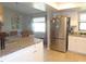 Bright kitchen featuring granite countertops, stainless steel appliances, and ample cabinet space at 2475 Wood Oak Dr, Sarasota, FL 34232
