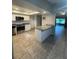 Beautifully updated kitchen featuring stainless steel appliances, granite counters, and a breakfast bar at 2475 Wood Oak Dr, Sarasota, FL 34232
