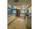 Modern kitchen with stainless steel appliances, granite countertops, and ample cabinet space at 2475 Wood Oak Dr, Sarasota, FL 34232