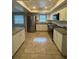 Updated kitchen with stainless steel appliances, granite counters, white cabinets, and stylish subway tile backsplash at 2475 Wood Oak Dr, Sarasota, FL 34232