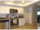Well-equipped kitchen with stainless steel appliances, subway tile backsplash, and updated cabinets at 2475 Wood Oak Dr, Sarasota, FL 34232