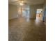 Spacious open-concept living room with neutral flooring and ample natural light at 2475 Wood Oak Dr, Sarasota, FL 34232