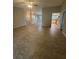 Spacious open-concept living room with neutral flooring and ample natural light at 2475 Wood Oak Dr, Sarasota, FL 34232