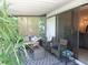 Covered patio area featuring comfortable outdoor seating and a private, screened-in space at 2475 Wood Oak Dr, Sarasota, FL 34232