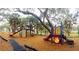Neighborhood playground with slides, climbing structures, and play areas for enjoyment at 2475 Wood Oak Dr, Sarasota, FL 34232