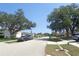 Quiet neighborhood streetscape lined with single-Gathering homes and mature shade trees at 2475 Wood Oak Dr, Sarasota, FL 34232
