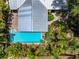 Bird's-eye view of a backyard oasis with a refreshing swimming pool and meticulously maintained landscaping at 2630 Bucida Dr, Sarasota, FL 34232