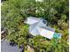 Stunning aerial view of home with lush tropical landscaping and a sparkling in-ground swimming pool at 2630 Bucida Dr, Sarasota, FL 34232