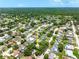 Neighborhood aerial featuring the residence in a community full of lush greenery and mature landscaping at 2630 Bucida Dr, Sarasota, FL 34232