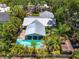 Aerial view showcasing a backyard pool, mature landscaping, and the home's overall layout at 2630 Bucida Dr, Sarasota, FL 34232