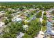 Aerial view of the neighborhood showing the home's location among mature trees and other residences at 2630 Bucida Dr, Sarasota, FL 34232