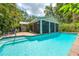 Inviting backyard features a private pool, screened lanai, and beautifully landscaped areas for relaxation at 2630 Bucida Dr, Sarasota, FL 34232