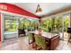 Bright dining area offering views of the pool and lush backyard through large glass doors at 2630 Bucida Dr, Sarasota, FL 34232