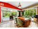 Bright dining room with views of the outdoor pool area at 2630 Bucida Dr, Sarasota, FL 34232