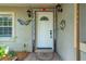 Exterior view of the front door with colorful accents and tiled details at 2630 Bucida Dr, Sarasota, FL 34232