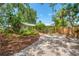 Charming single-story home with a brick walkway, lush landscaping and a well-manicured front yard at 2630 Bucida Dr, Sarasota, FL 34232