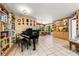 Living room featuring tile flooring, eclectic decor and direct access to dining area at 2630 Bucida Dr, Sarasota, FL 34232