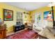 Bright living room with cozy seating, a unique decor, and natural light from the large window at 2630 Bucida Dr, Sarasota, FL 34232