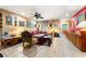 Open-concept living room featuring unique decor, tile flooring and plentiful natural light at 2630 Bucida Dr, Sarasota, FL 34232