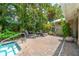Relax and unwind in the private backyard oasis with a pool, patio, and plenty of seating at 2630 Bucida Dr, Sarasota, FL 34232
