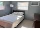Cozy bedroom with a full-size bed, and natural light streaming through the bright windows at 2833 62Nd N St, St Petersburg, FL 33710