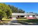 Charming single-story home with a well-manicured lawn and a vibrant exterior paint scheme at 2833 62Nd N St, St Petersburg, FL 33710