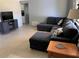 Spacious living room with a large sectional sofa, side table, and stylish furniture at 2833 62Nd N St, St Petersburg, FL 33710