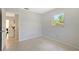 Bedroom with a light gray wall and a window offering a scenic view at 3127 Dawson St, Sarasota, FL 34239