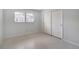 Cozy bedroom with neutral walls, closet, and a window providing natural light at 3127 Dawson St, Sarasota, FL 34239
