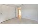 Bedroom features a spacious closet for storage and gray floors at 3127 Dawson St, Sarasota, FL 34239
