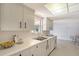 This kitchen features bright cabinets, a stainless sink, and a window for natural light at 3127 Dawson St, Sarasota, FL 34239