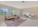 Bright and airy living room with large windows, comfortable furniture, and stylish decor at 3127 Dawson St, Sarasota, FL 34239